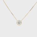 Lab-grown brilliant round diamond pendant necklace in 18k yellow gold, bezel set. 