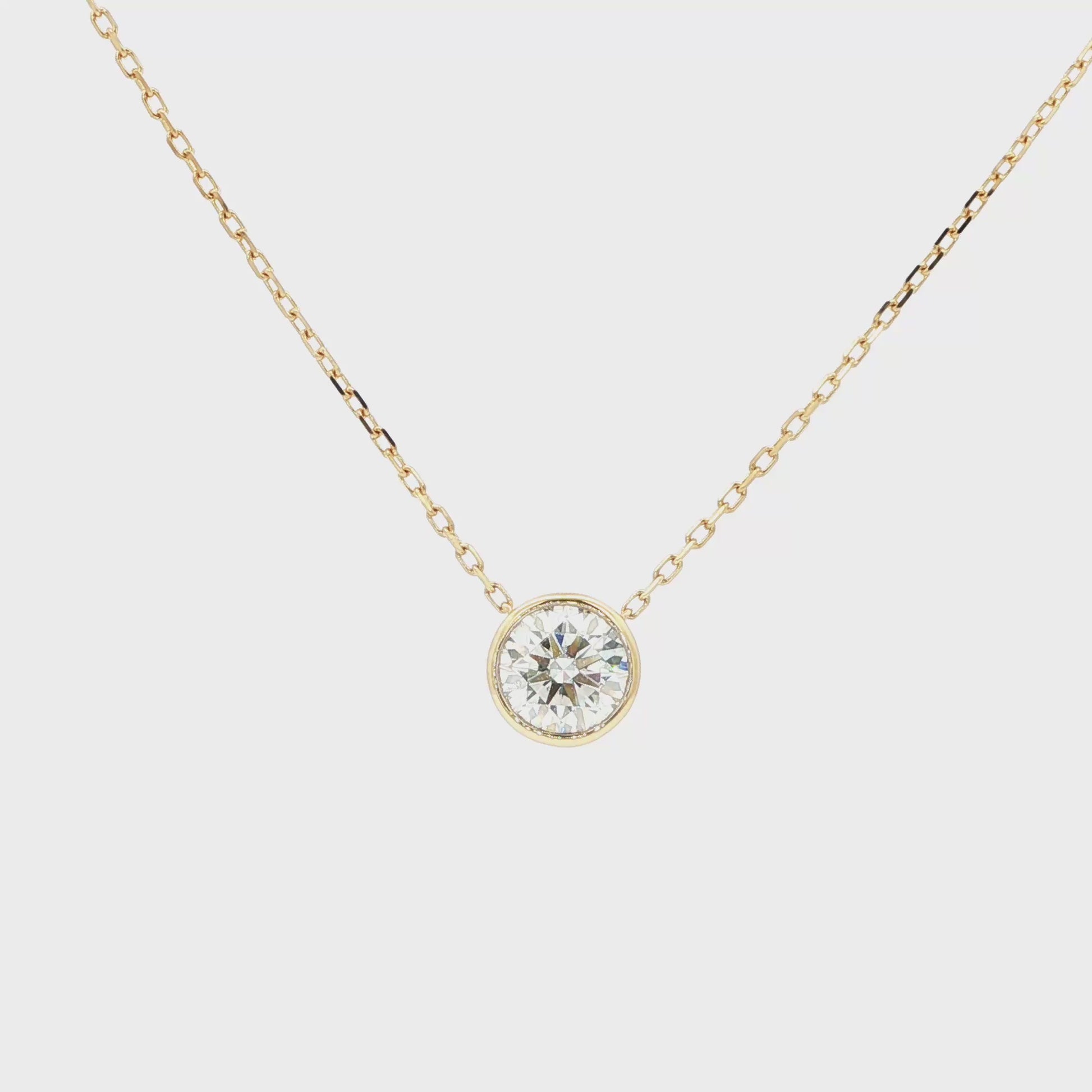 Lab-grown brilliant round diamond pendant necklace in 18k yellow gold, bezel set. 