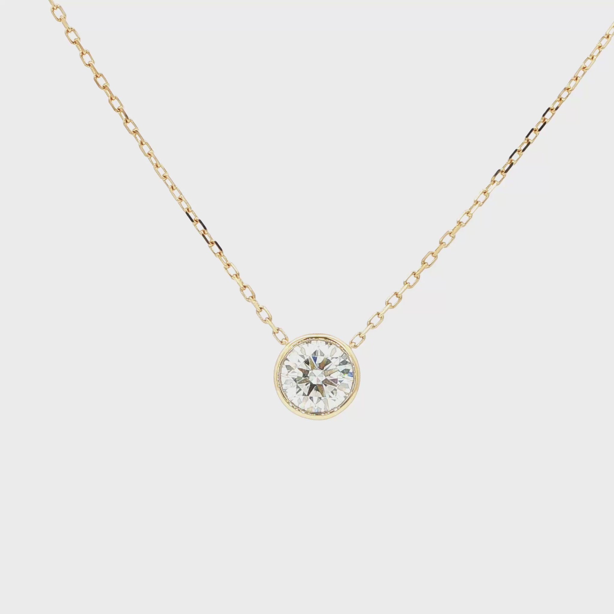 Lab-grown brilliant round diamond pendant necklace in 18k yellow gold, bezel set. 