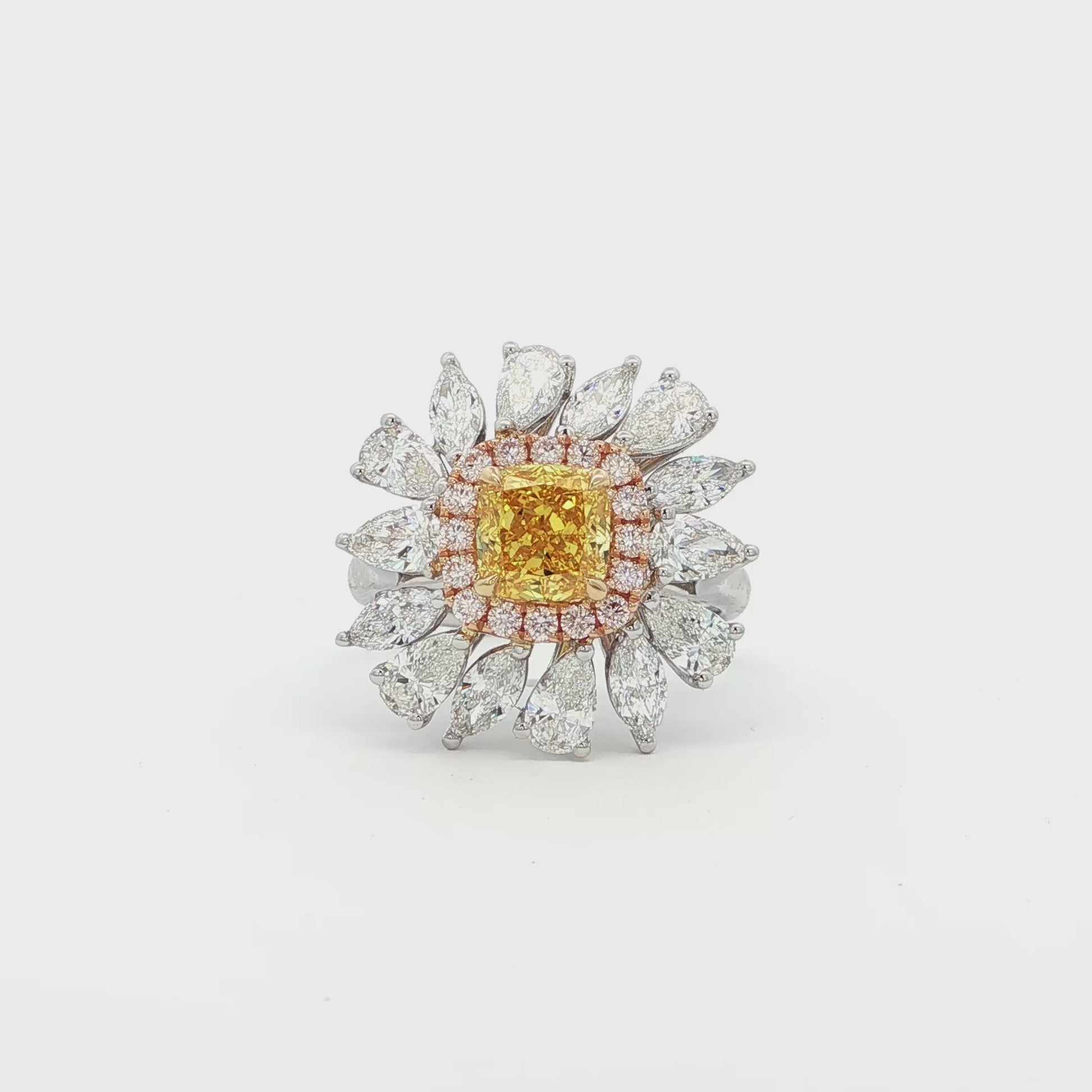 18K_White_Gold_Yellow_Gold_Rose_Gold_Luine_Ring_Lab_Grown_Diamonds_Fancy

The sunflower-inspired Lumine ring is crafted in 18K tri-color gold (White, Yellow, and Rose Gold). At the centre is a fancy yellow cushion-cut diamond set in Yellow Gold. Surrounding it is a halo of pink diamonds set in Rose Gold. Completing the bloom are "petals" of white diamond set in White Gold. The result is a bold and captivating dual-tone statement piece, perfect for adding a touch of glamour to any evening look.
