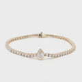 14K Yellow Gold Pear-Cut Bezel-Set Lab-Grown Diamond Tennis Bracelet

An elegant tennis bracelet showcasing a seamless line of Round-cut Lab-Grown Diamonds, accented by a captivating Pear center stone in a bezel setting. Crafted in 14K Yellow Gold, this piece embodies exquisite craftsmanship as the warm gold enhances the radiance of every diamond. The bezel-framed pear center creates a modern focal point within a timeless silhouette, making it perfect for everyday luxury or special occasions. 
