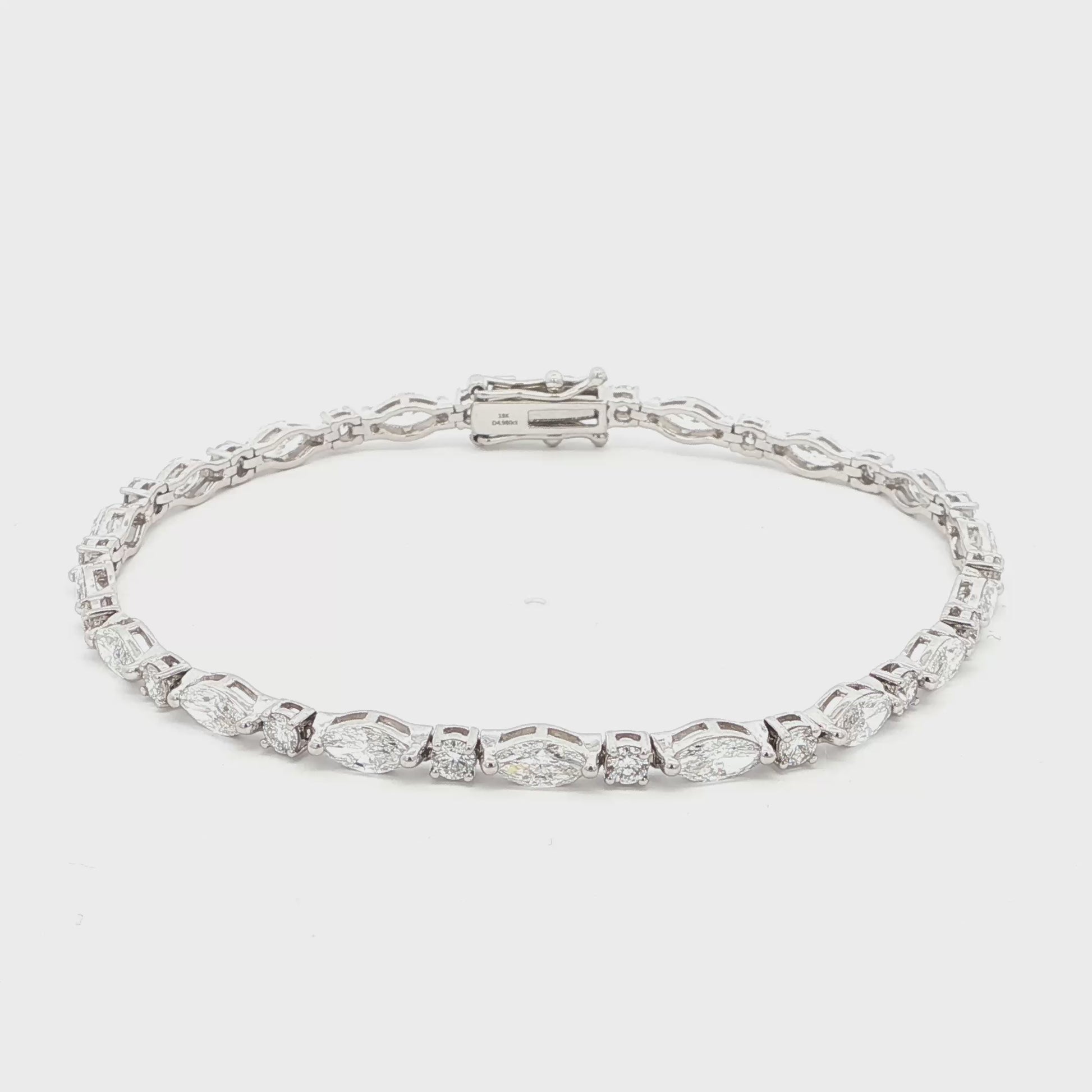 18K White Gold Marquise and Round Cut Lab-Grown Diamond Bracelet 

A modern take on the classic tennis bracelet. This 18K White Gold bracelet features marquise and round-cut diamonds in a clean geometric design. The contrast of shapes creates subtle movement and light play.