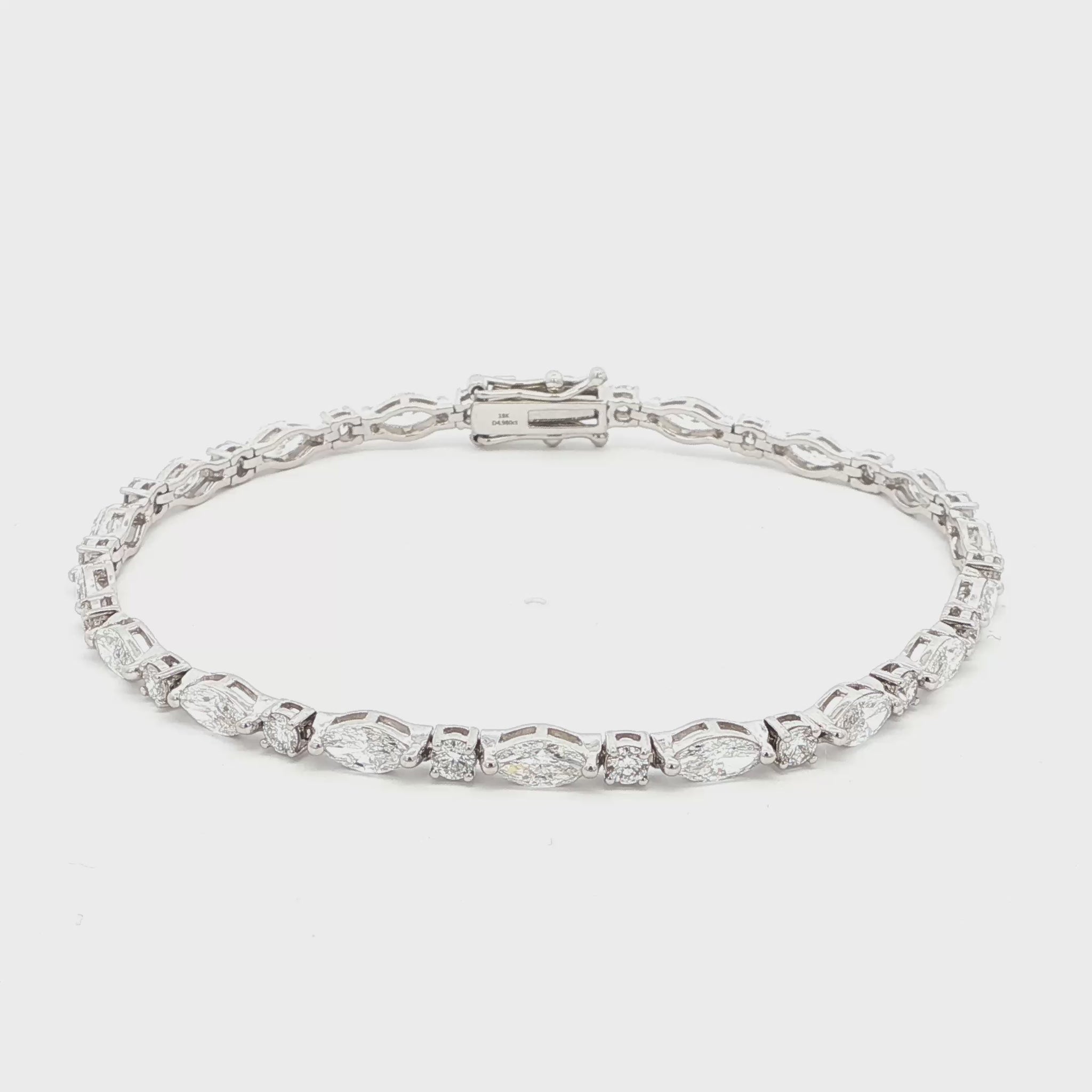 18K White Gold Marquise and Round Cut Lab-Grown Diamond Bracelet 

A modern take on the classic tennis bracelet. This 18K White Gold bracelet features marquise and round-cut diamonds in a clean geometric design. The contrast of shapes creates subtle movement and light play.