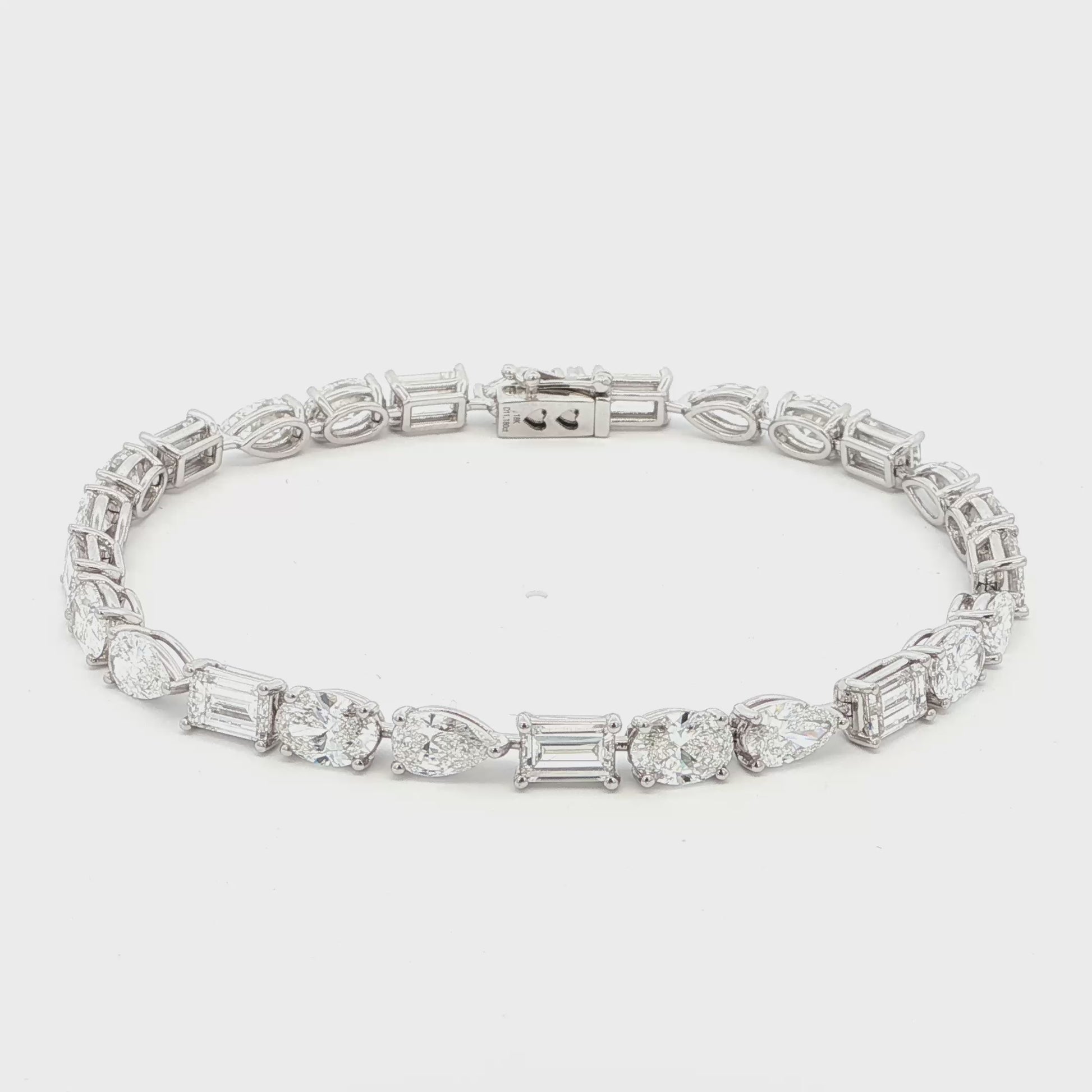 18K White Gold, Fancy Shape, Baguette, Pear, and Oval Cut Tennis Bracelet 

Crafted in 18K White Gold, this exquisite tennis bracelet showcases an alternating pattern of Baguette, Pear, and Oval-Cut Lab-Grown Diamonds. Meticulous craftsmanship shines through each prong-set facet, delivering a rhythmic, multidimensional sparkle from every angle. This modern blend of three shapes creates a timeless yet contemporary elegance, perfect for elevating moments that deserve to shine. 