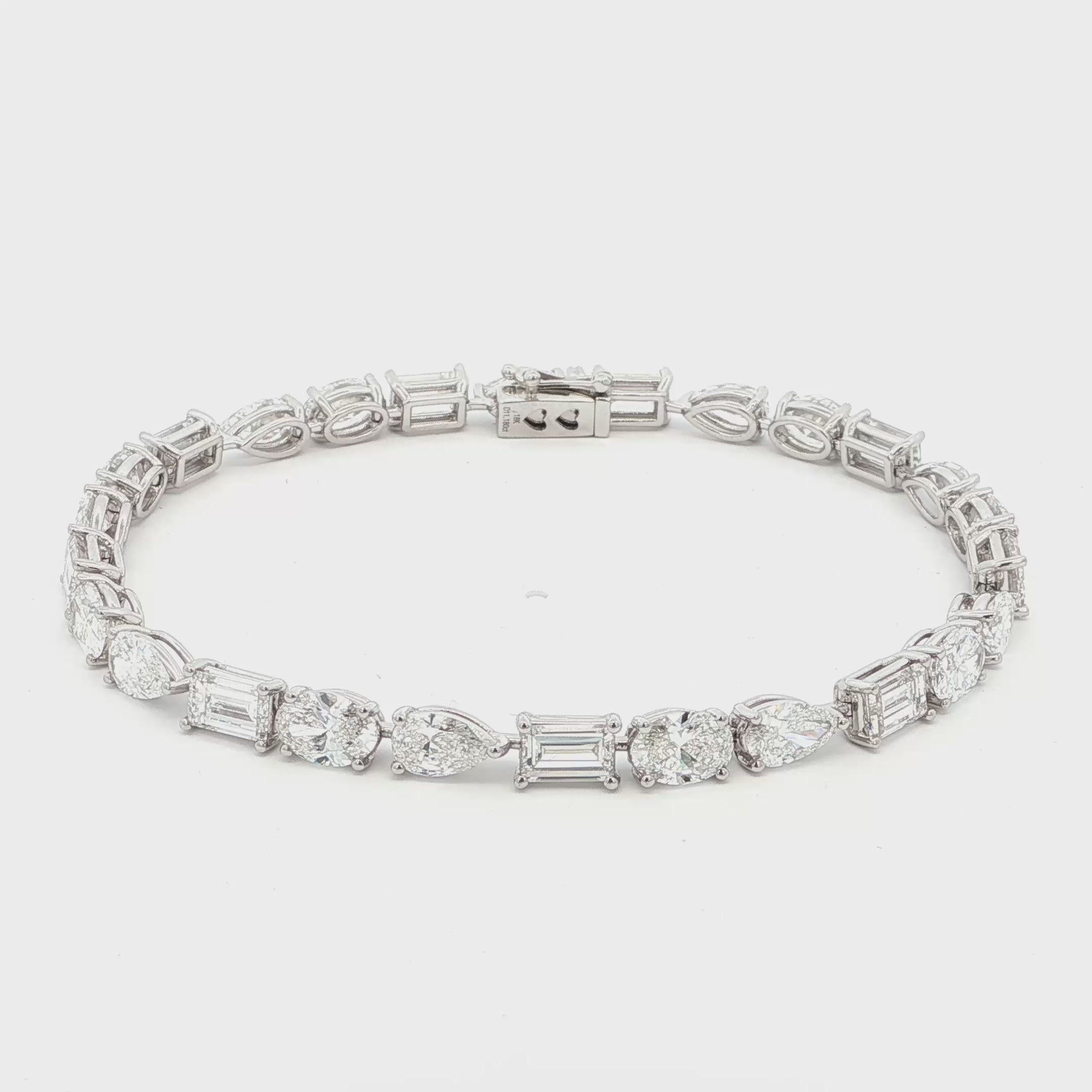18K White Gold, Fancy Shape, Baguette, Pear, and Oval Cut Tennis Bracelet 

Crafted in 18K White Gold, this exquisite tennis bracelet showcases an alternating pattern of Baguette, Pear, and Oval-Cut Lab-Grown Diamonds. Meticulous craftsmanship shines through each prong-set facet, delivering a rhythmic, multidimensional sparkle from every angle. This modern blend of three shapes creates a timeless yet contemporary elegance, perfect for elevating moments that deserve to shine. 