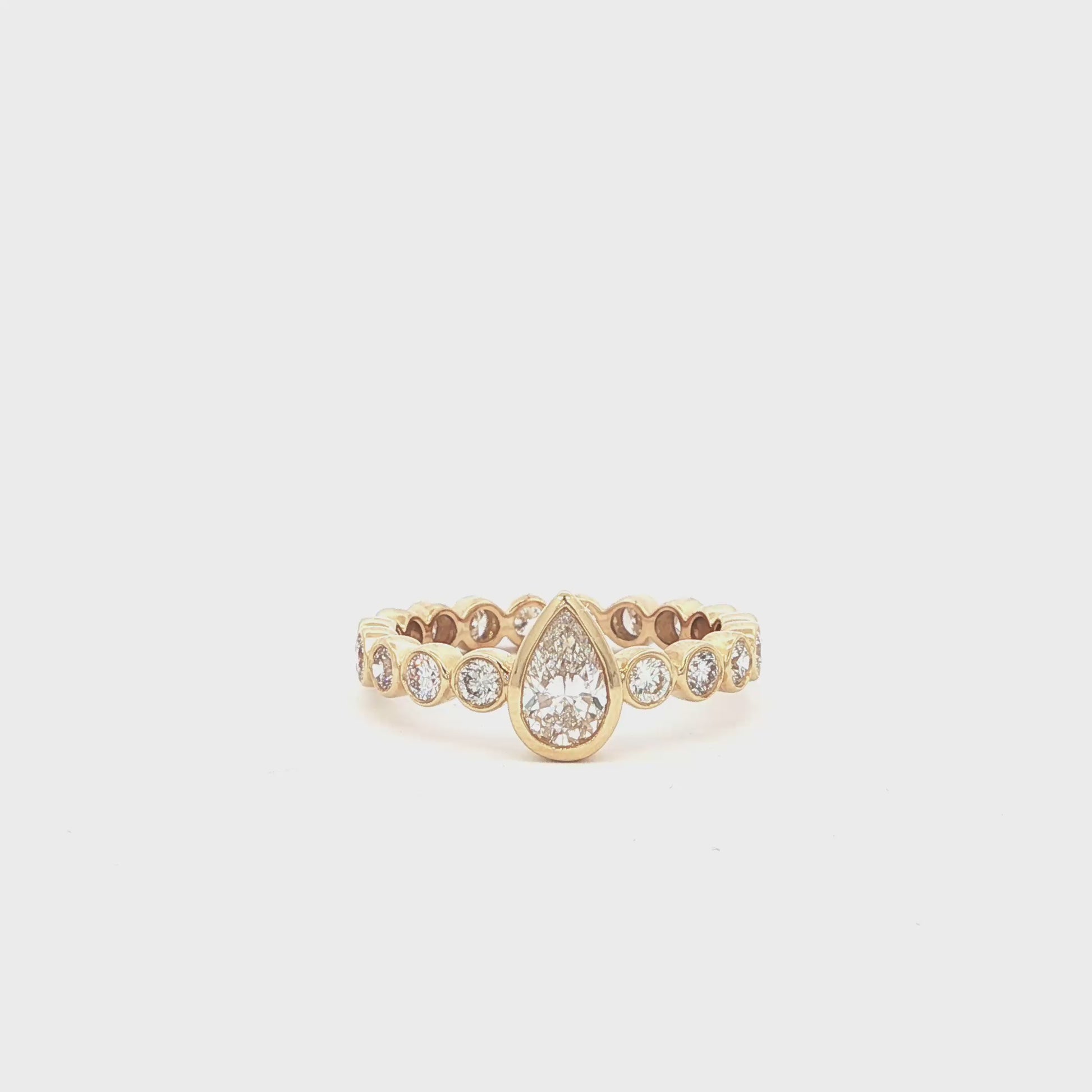 Pear lab-grown diamond ring in bezel setting, 14k yellow gold. 