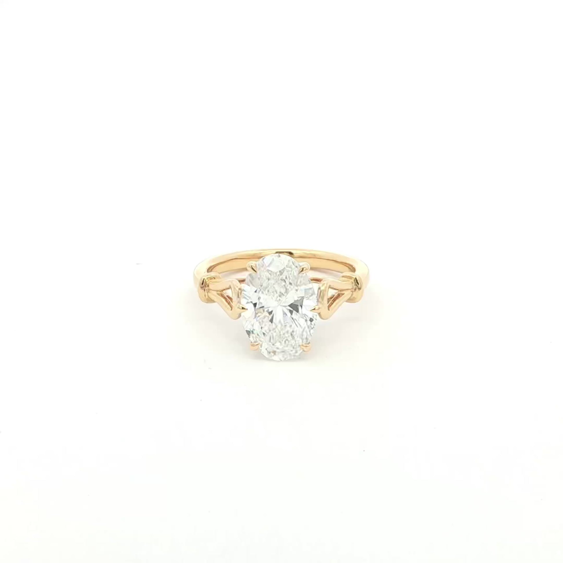 Oval solitaire lab-grown diamond ring in tapered cathedral setting, 18k yellow gold. 
