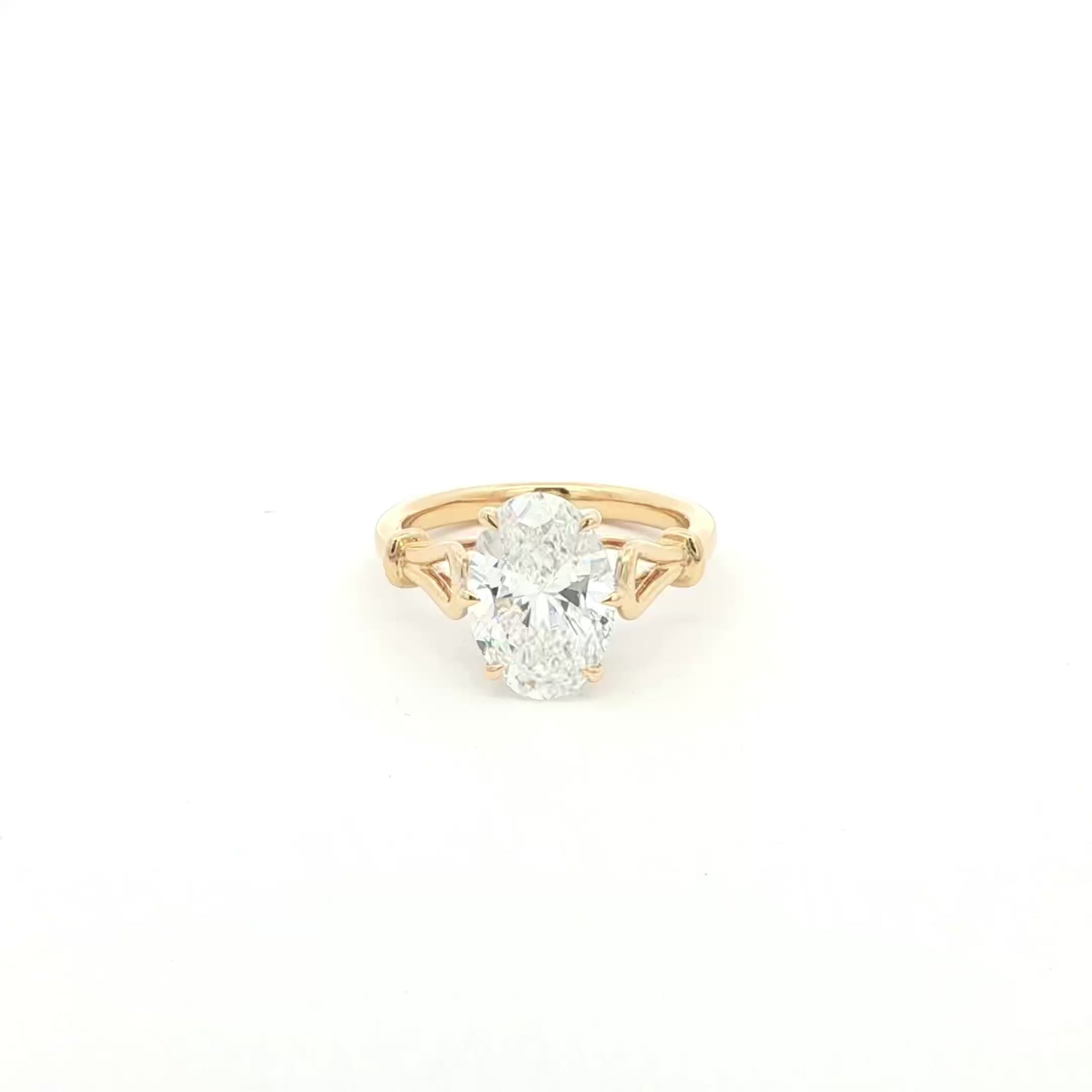 Oval solitaire lab-grown diamond ring in tapered cathedral setting, 18k yellow gold. 