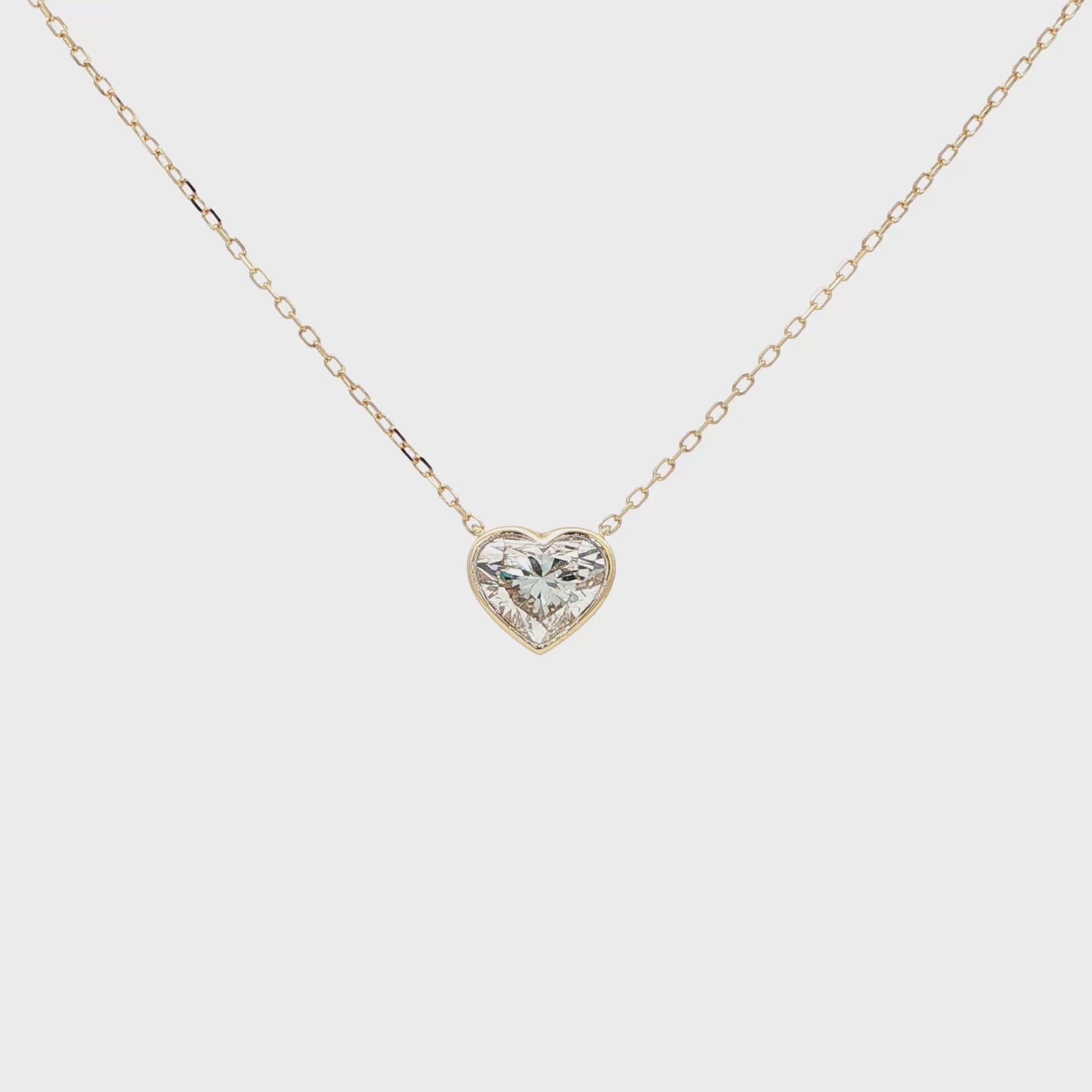 Lab-grown fancy heart diamond pendant necklace in 18k yellow gold, bezel set.