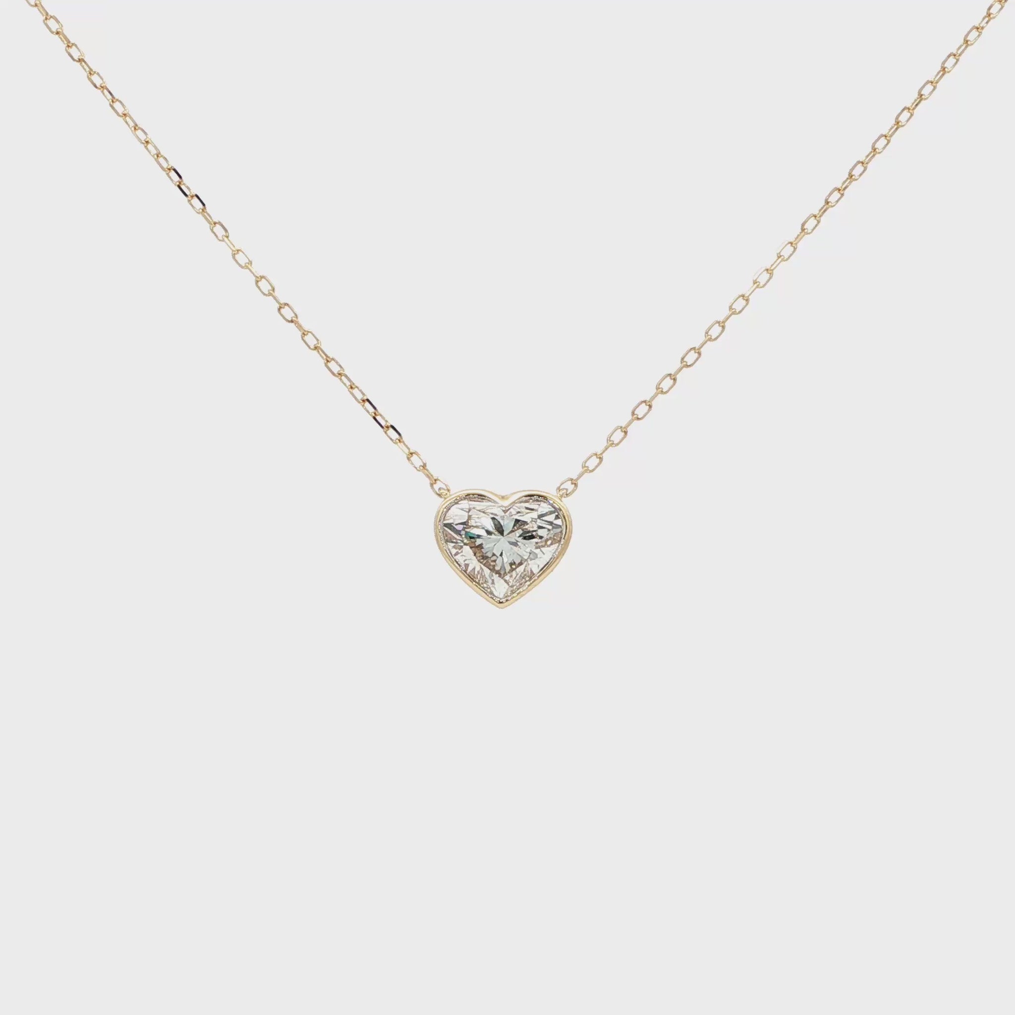 Lab-grown fancy heart diamond pendant necklace in 18k yellow gold, bezel set.