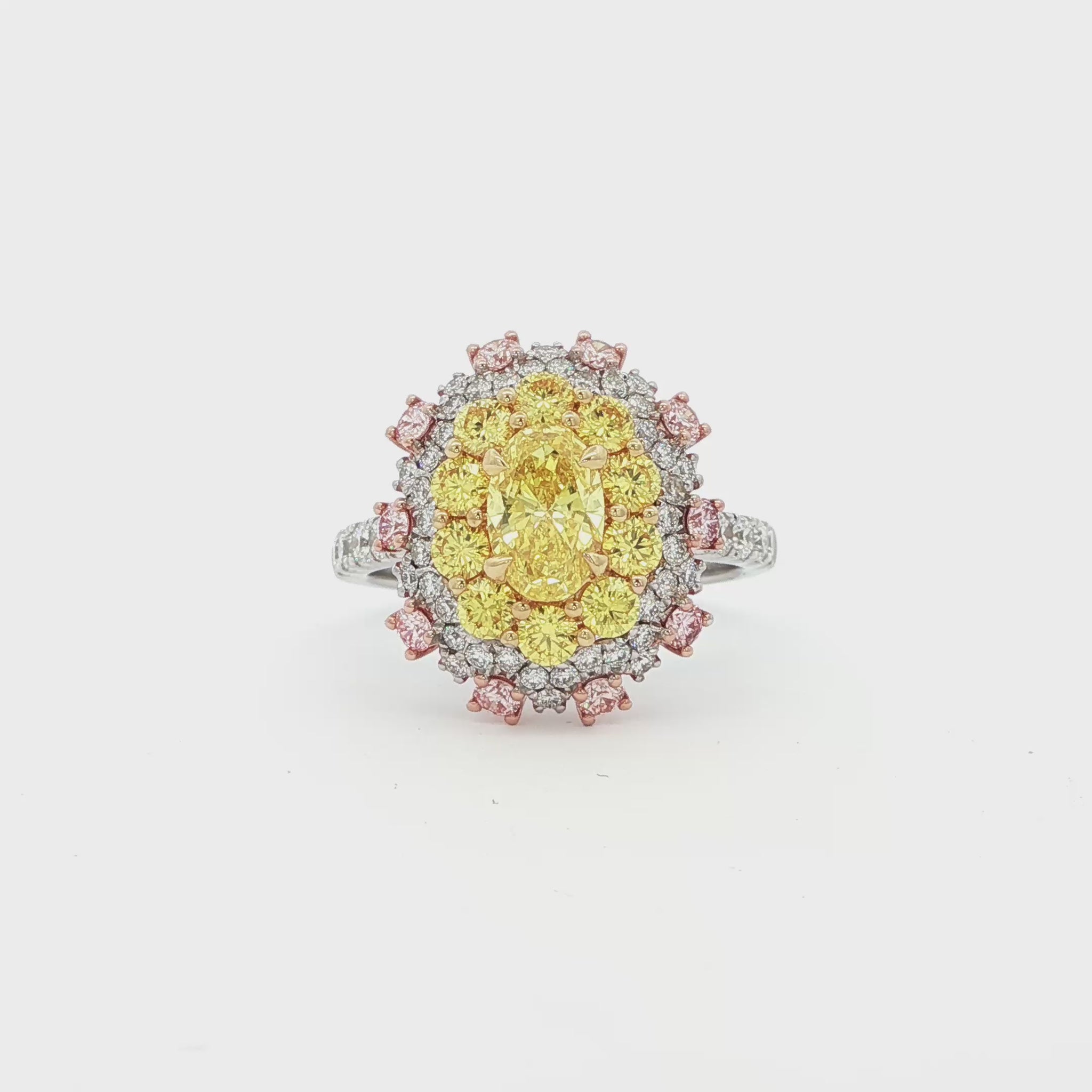 18K_Yellow_Gold_Lab_Grown_Diamond_Ring_Statement_Cocktail_Engagement_Evening

This 18K Yellow Gold ring showcases a vibrant center of brilliant yellow diamonds, elegantly encircled by a halo of pink and white diamonds. The bold contrasts of colors create a captivating play of light, making it a true statement piece for any occasion.