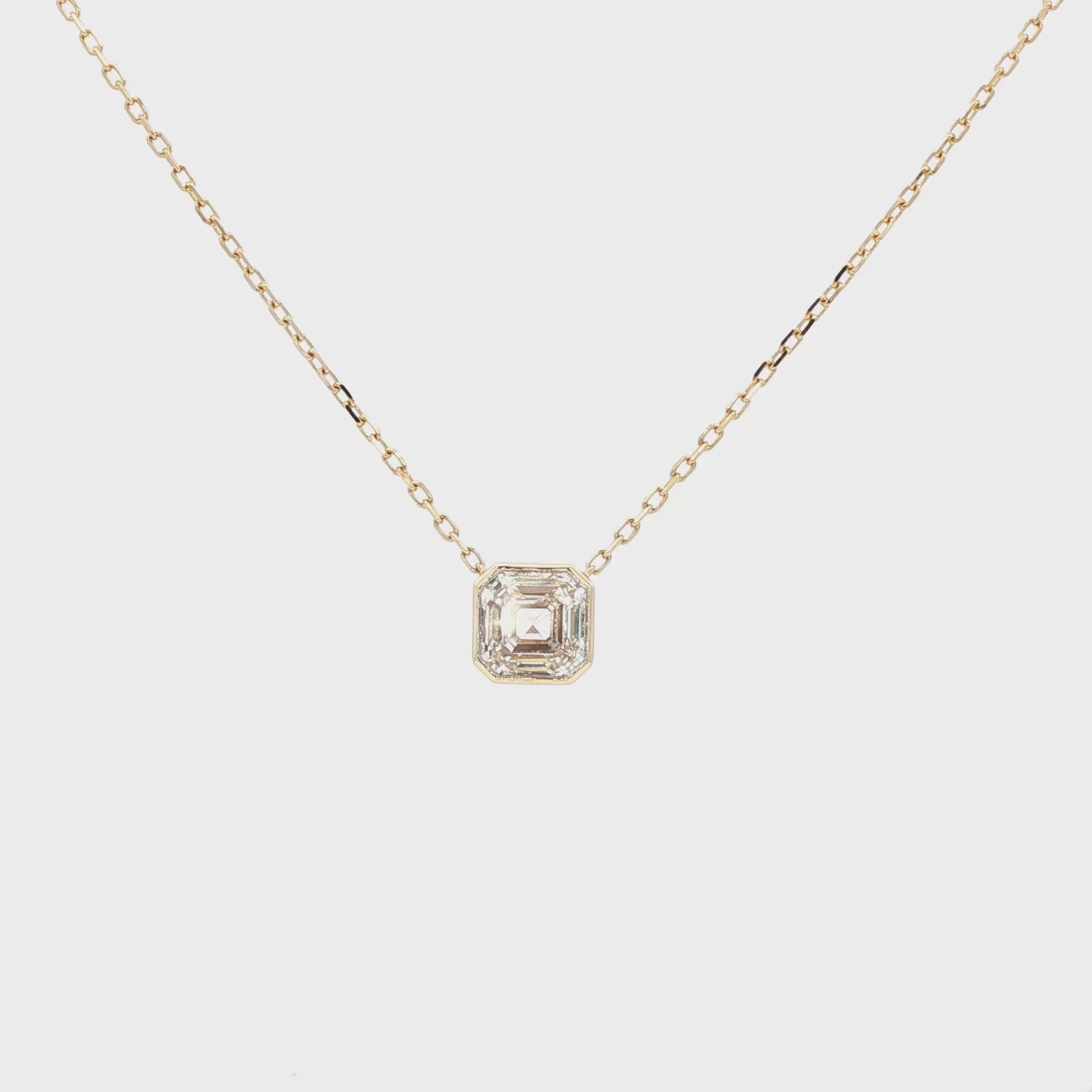 Lab-grown asscher diamond pendant necklace in 18k yellow gold, bezel set. 