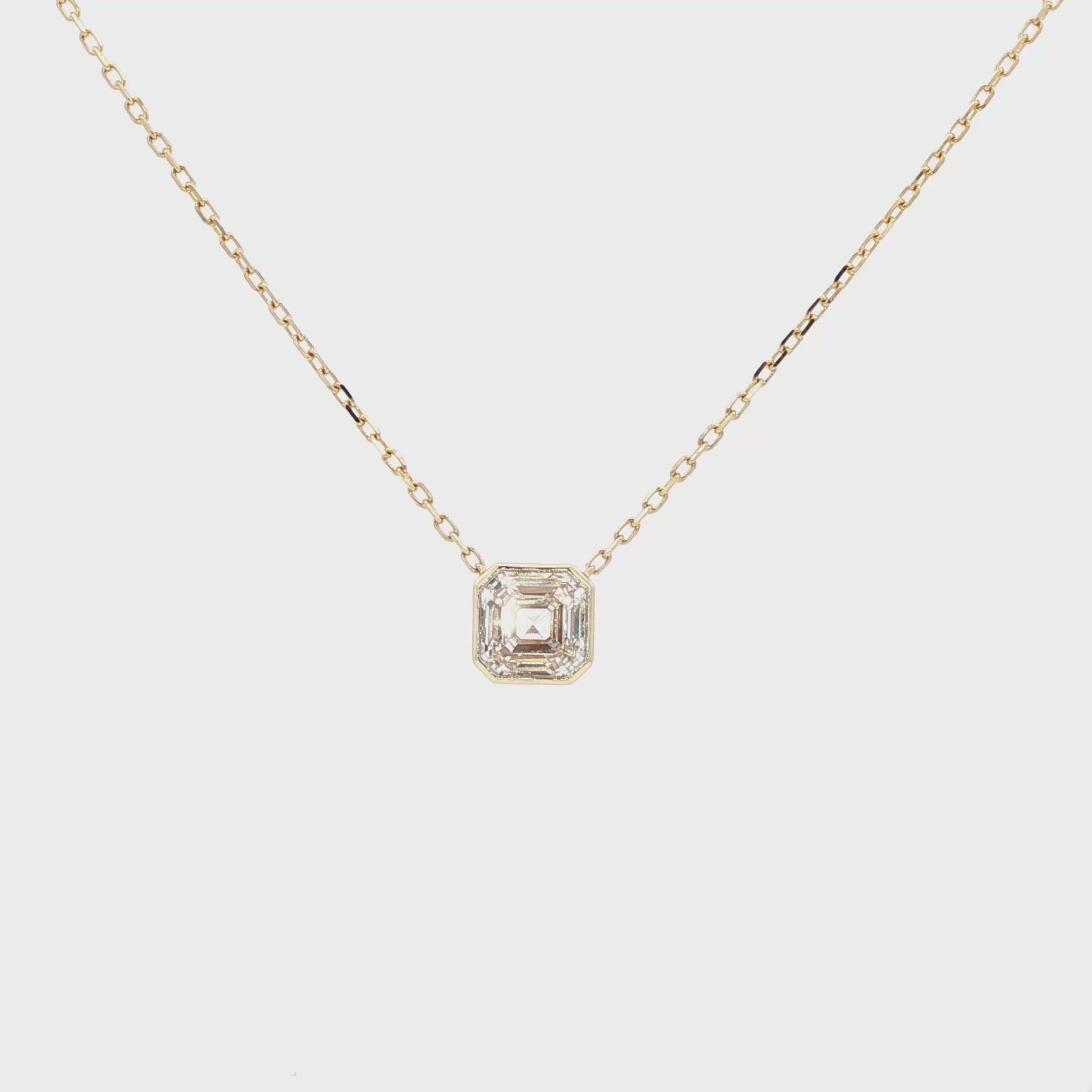 Lab-grown asscher diamond pendant necklace in 18k yellow gold, bezel set. 