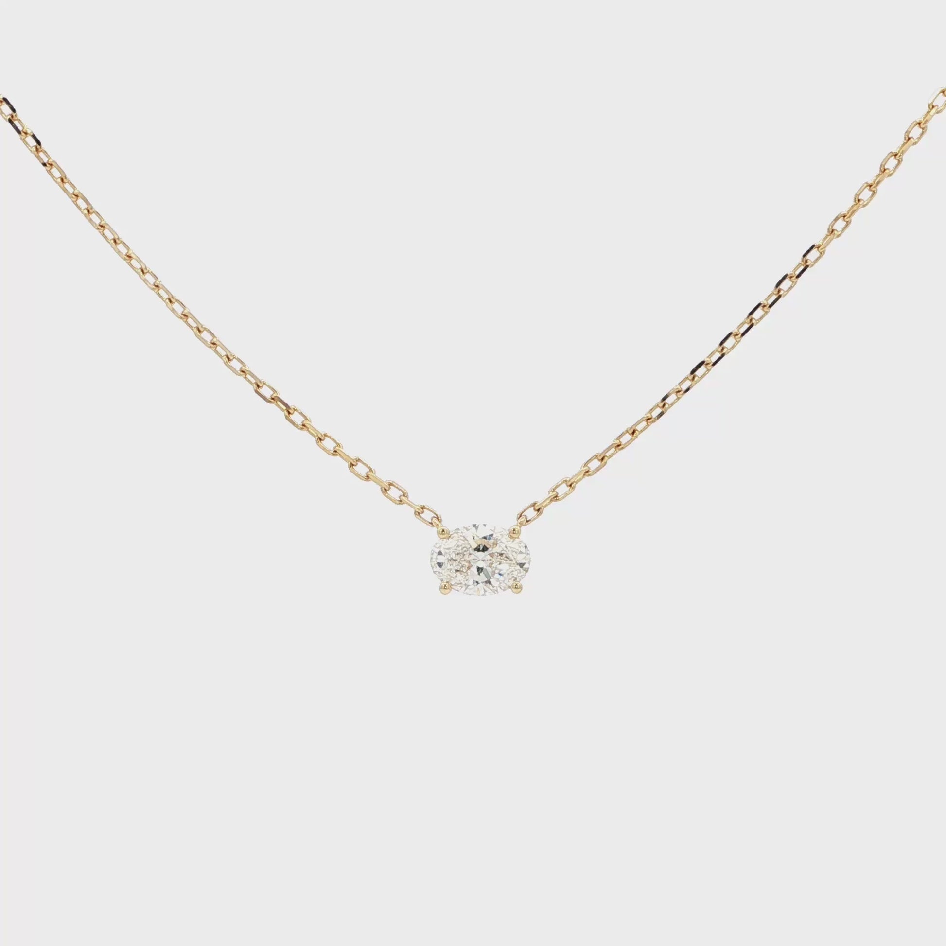 Lab-grown oval diamond pendant necklace in 18k yellow gold. 