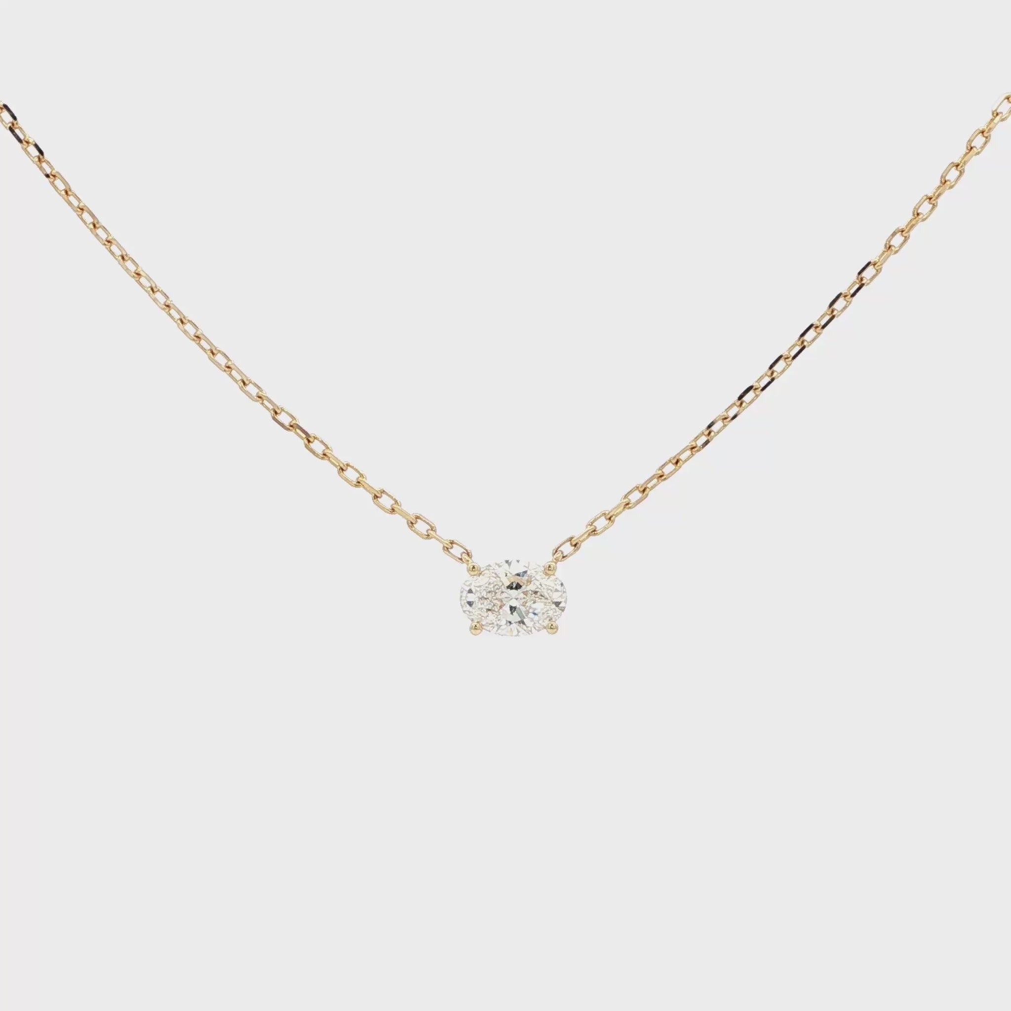Lab-grown oval diamond pendant necklace in 18k yellow gold. 