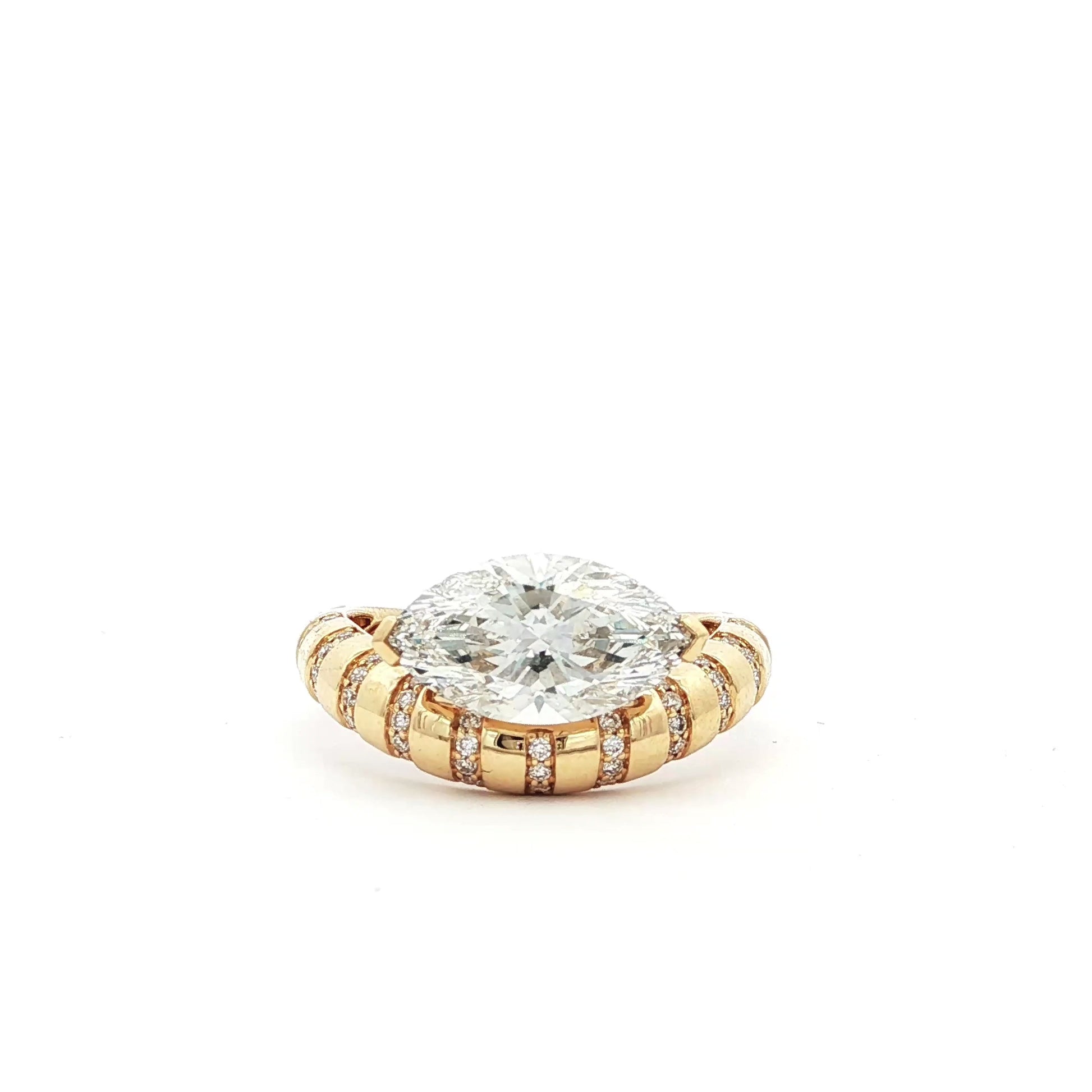 18K_Yellow_Gold_Marquise_East_West_Lab_Grown_Diamonds_Ring_Engagement_Everyday_Evening_Cocktail_Statement

This 18K Yellow Gold ring showcases a Marquise centre stone set on a bold band, decorated with sparkling diamonds. Its exquisite craftsmanship and sophisticated design make it the perfect statement piece for any look!